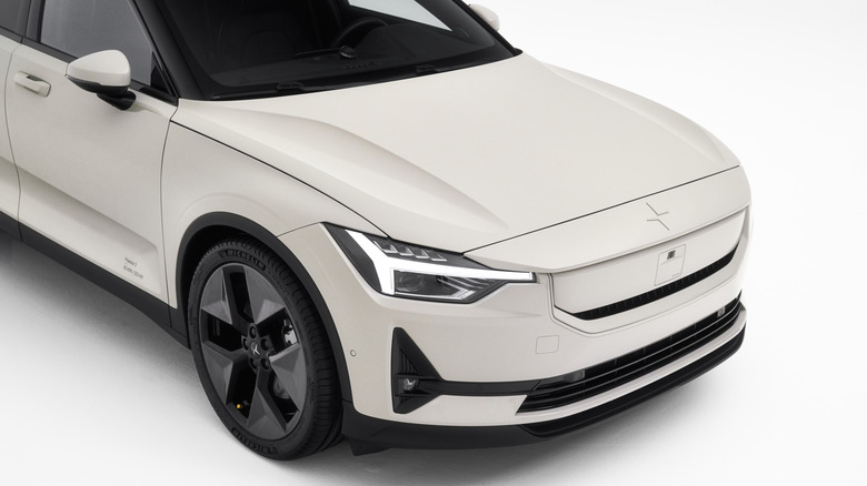 Overhead front shot of a white Polestar 2 in a studio setting