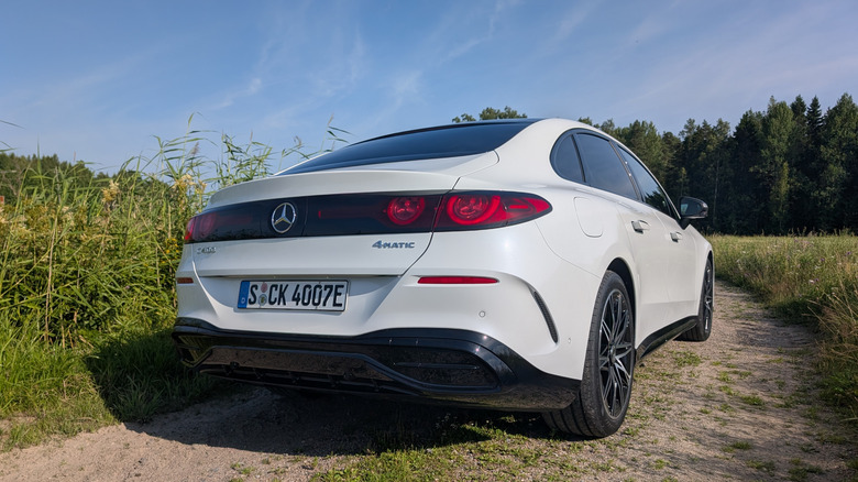 rear 3/4s view of a white electric Mercedes-Benz C-Class