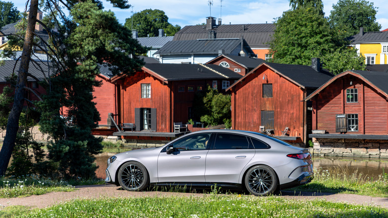 Side view of a grey electric Mercedes-Benz C-Class in a town