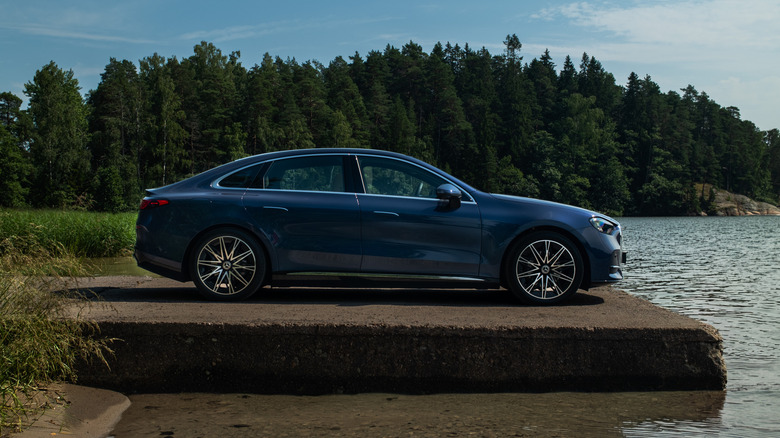 a dark blue electric Mercedes-Benz C-Class parked on a dock