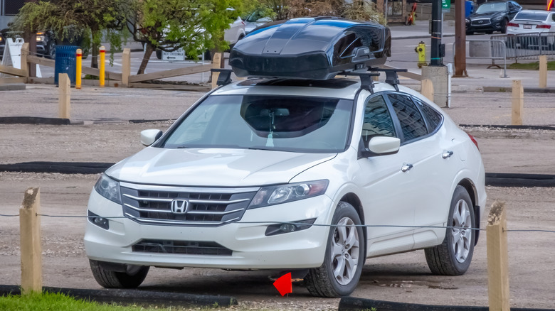 Calgary, Alberta, Canada. May 31, 2024. A Honda Accord Crosstour with a cargo box, parked in the springtime.