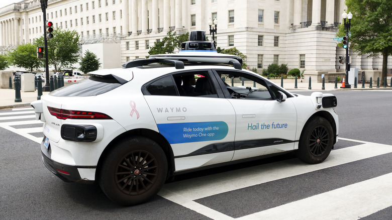 WASHINGTON, DC - JUNE 8: A Waymo autonomous Jaguar I-PACE vehicle is driven on a road on June 8, 2026 in Washington, DC. Waymo is still in the testing phase and is not yet operating commercially in the region. (Photo by Kevin Carter/Getty Images)